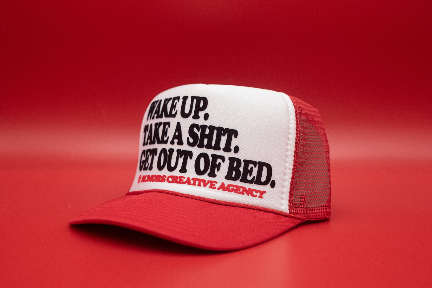 The "Wake Up. Take A Shit. Get Out Of Bed." Funny Trucker Hat